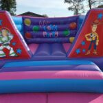 an 8ft toy story themed castle in pink and purple