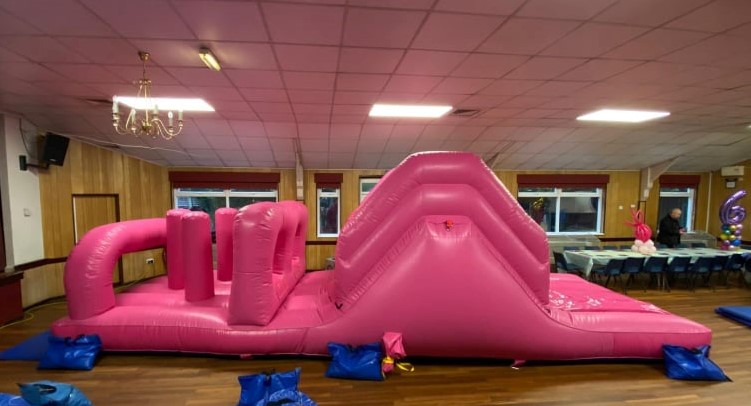 a shiny and pink themed obstacle course