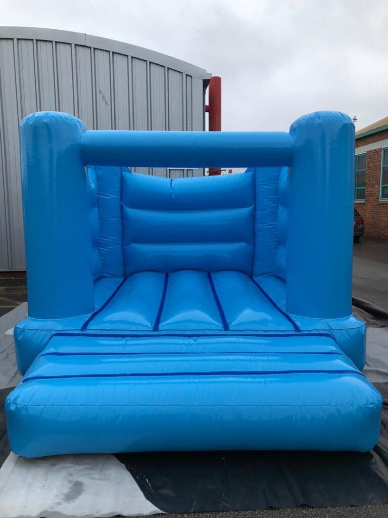 a pastel blue 10x12 bouncy castle