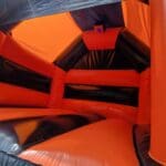 a view from inside the orange black shiny themed castle with slide